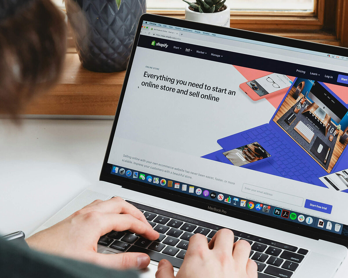 Man Working With Shopify on his laptop