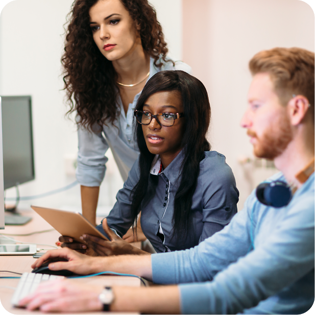Developers and account managers looking at monitor