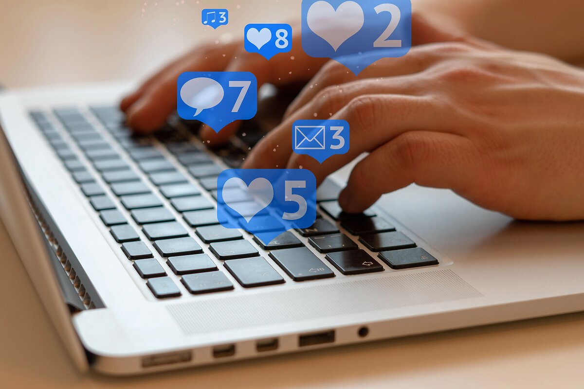 Laptop with heart emoji reactions